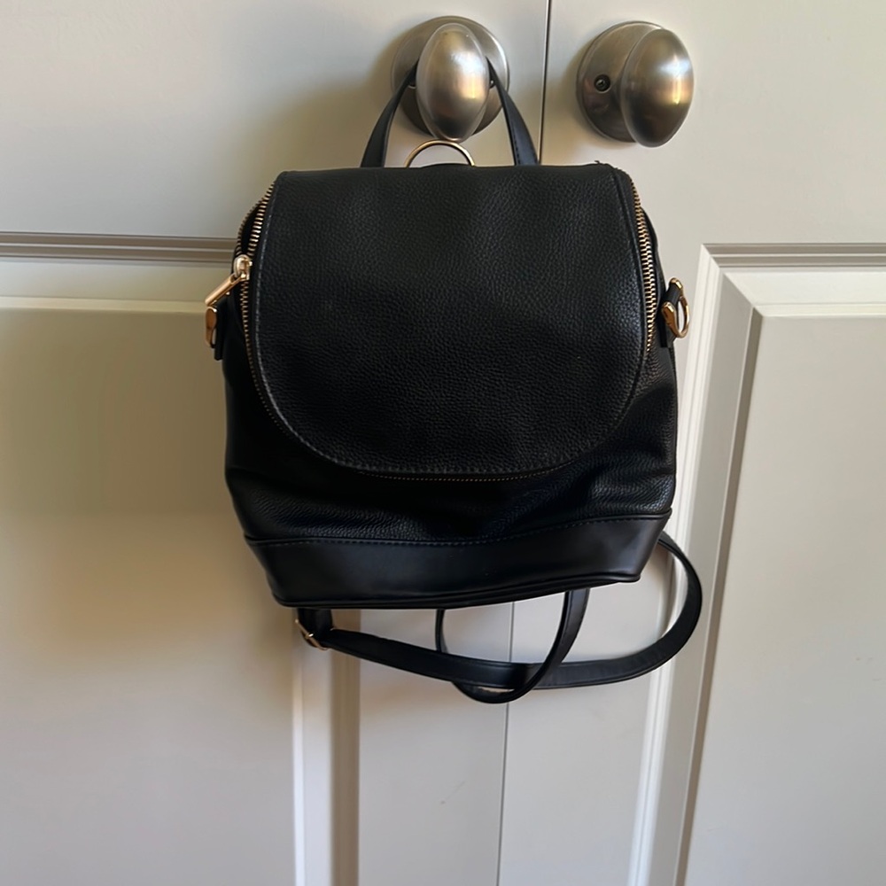 Black faux leather back back. Small. A new day brand.